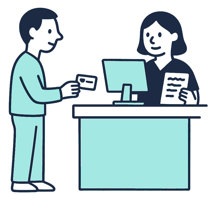 A migrant worker at a private clinic reception desk holding an insurance card while a receptionist checks a screen