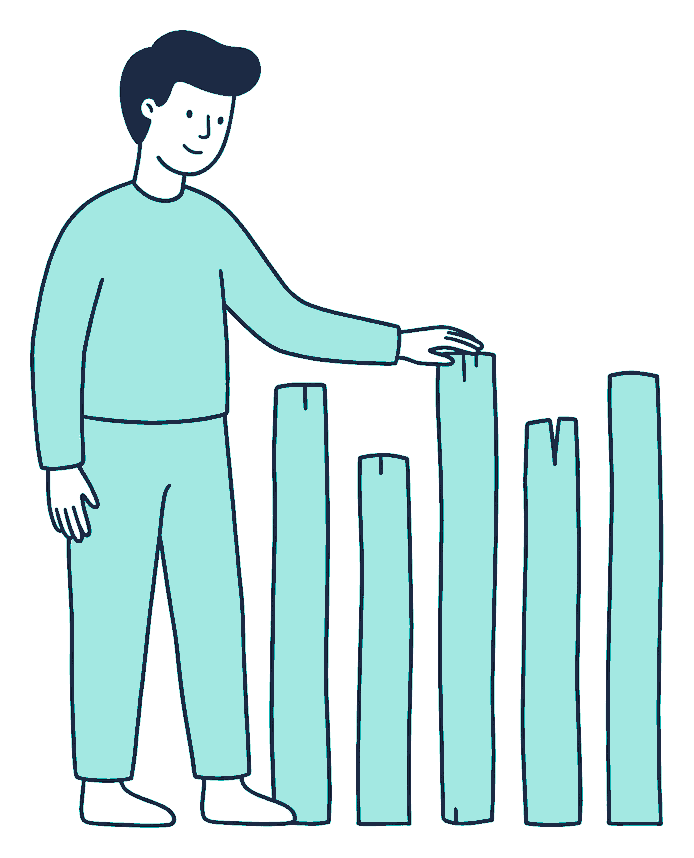 A person comparing six fence posts cut to six different heights