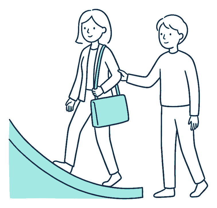 A woman walks up a gentle ramp carrying a work bag while another person steadies her elbow