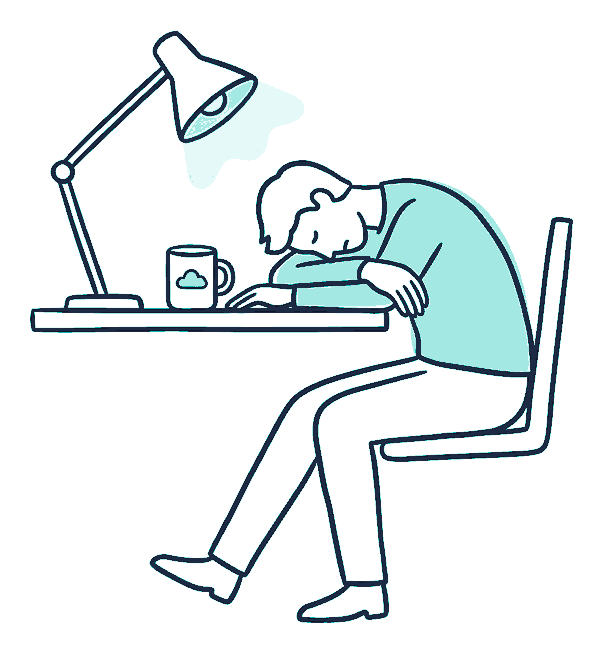 A worker slumps head-down on folded arms beside a cold mug as a desk lamp burns late
