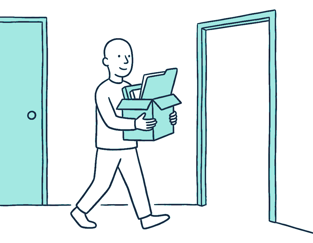 A person carries a cardboard box of desk belongings out through one doorway toward another, a folder balanced on top