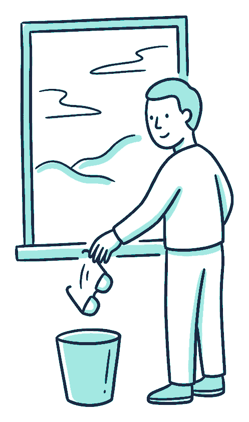 A person drops a pair of spectacles into a small bin while looking clearly out a window