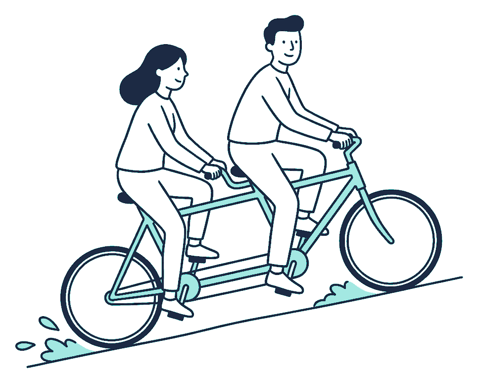 Two riders pedal a tandem bicycle up a slope together, one steadying the handlebars
