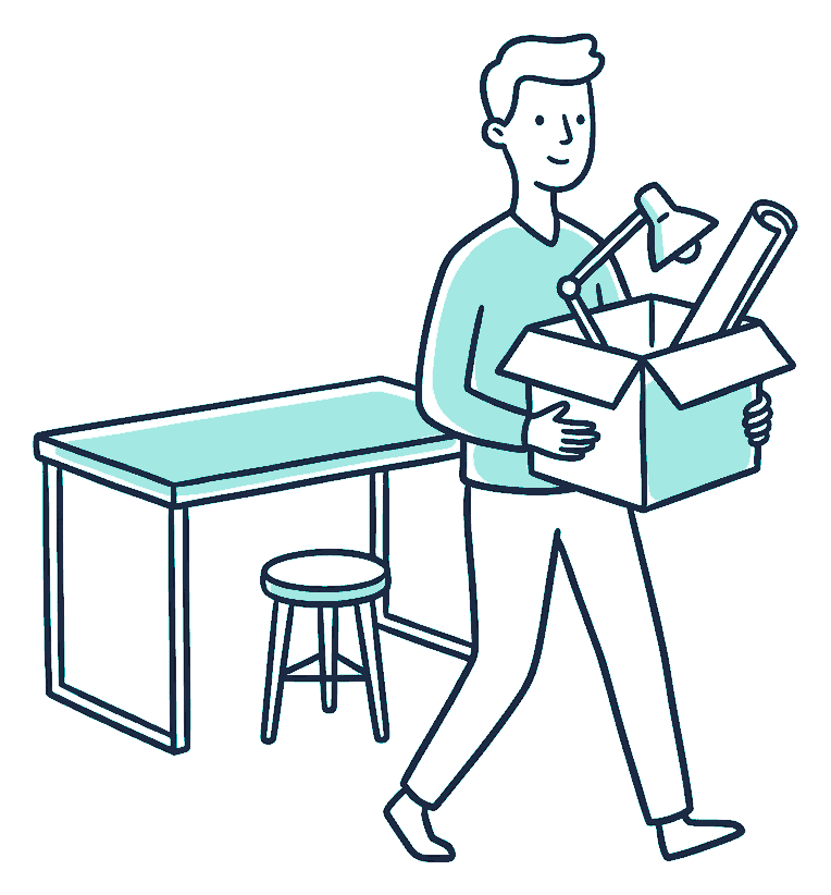 A person carrying a packed box of desk things away from an empty desk