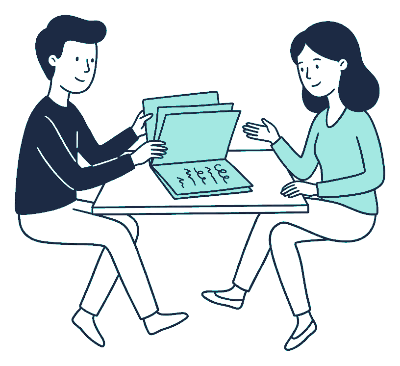 An adviser and a client sit across a desk turning pages of an open folder of squiggly scribble lines
