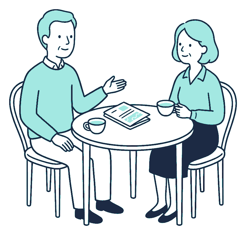 An older couple talking over a folded policy document and a cup of tea each