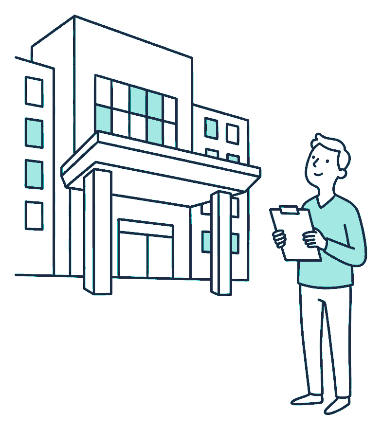 A person with a clipboard looking up at a hospital building