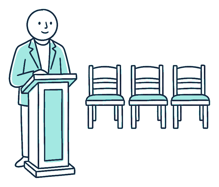 A company director stands alone at a wooden courtroom lectern with an empty row of seats behind him